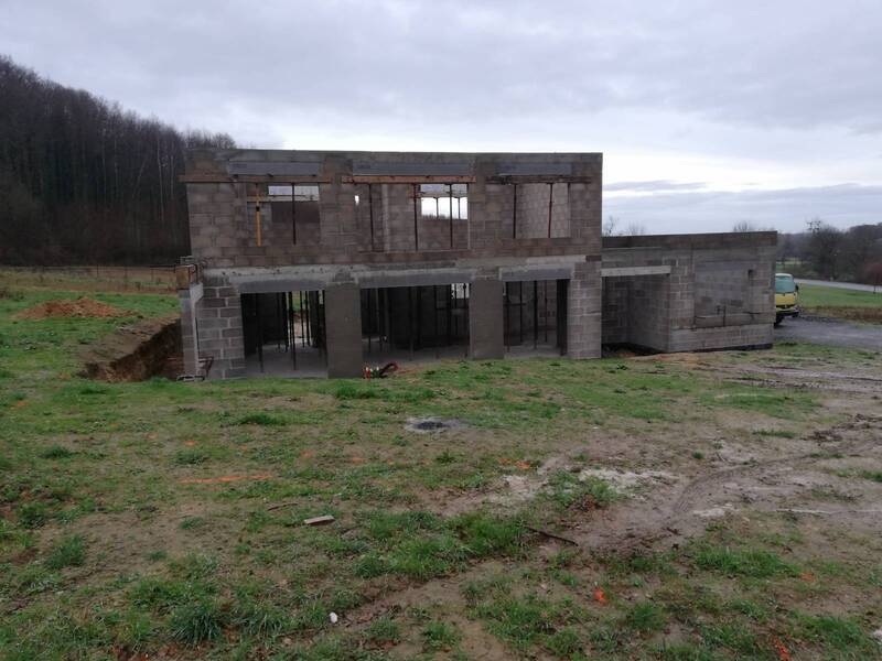 Construction d'une maison en agglos à Henon